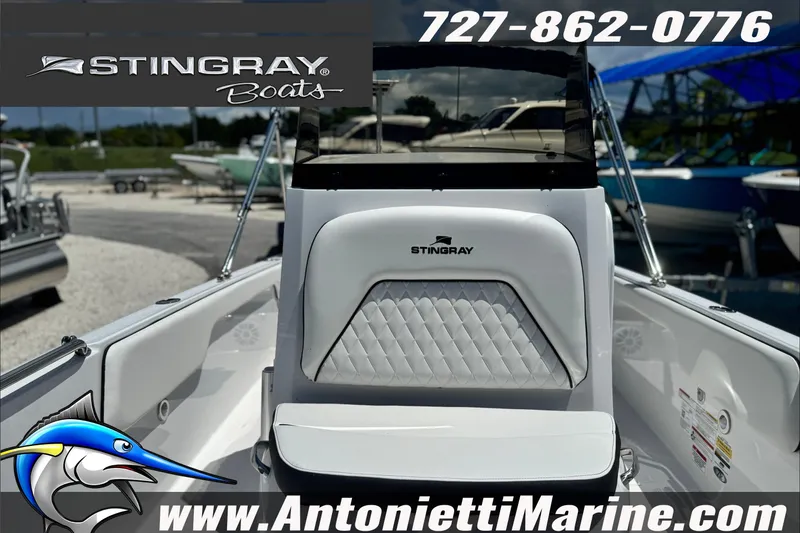 Slide: The Image of 2027 Stingray 17 CC boat interior with logo, contact number, and dealership website. - 14