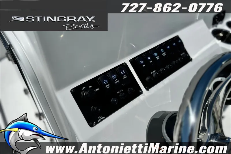 Slide: The Image of Control panel of 2027 Stingray 17 CC boat with steering wheel and switches. - 19