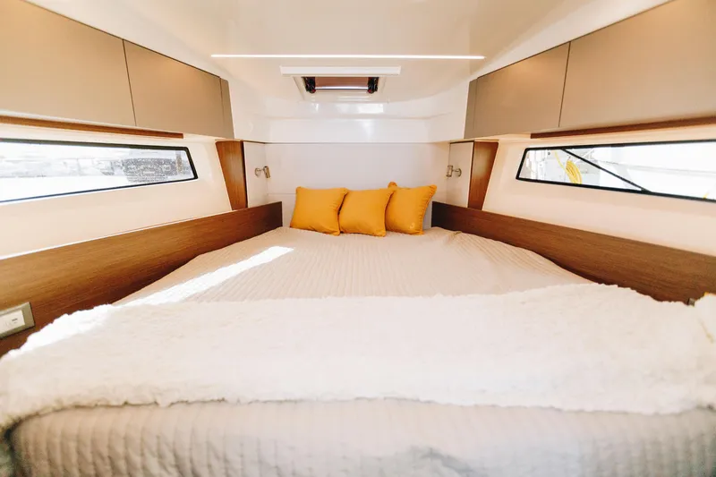 Slide: The Image of Luxurious cabin interior of 2026 Beneteau Antares 9 with cozy bedding. - 17