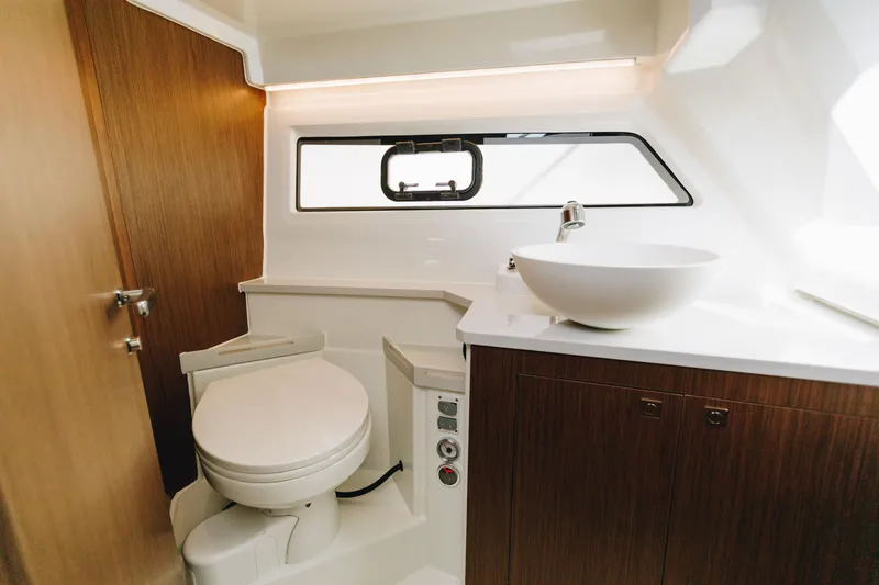 Slide: The Image of Luxurious bathroom interior of 2026 Beneteau Antares 9 yacht, featuring modern fixtures and wood accents. - 19