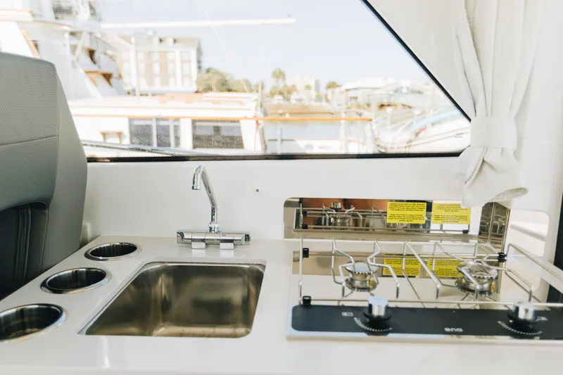Slide: The Image of Interior view of 2026 Beneteau Antares 9 yacht kitchen with sink and stove. - 15