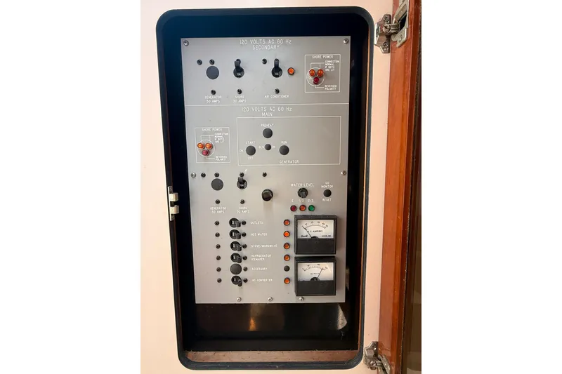 Slide: The Image of Electrical control panel of a 1989 Sea Ray 340 Sundancer boat. - 32