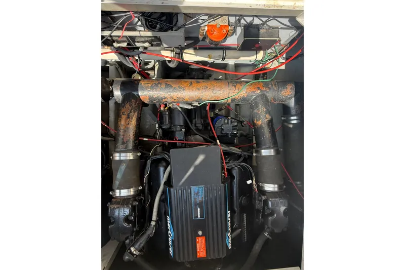 Slide: The Image of Engine compartment of a 1989 Sea Ray 340 Sundancer with visible wiring and components. - 34