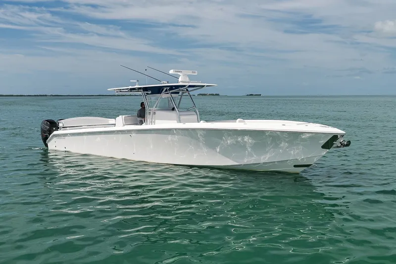 Slide: The Image of 2016 Bahama 41 boat on calm turquoise waters under a clear sky. - 3