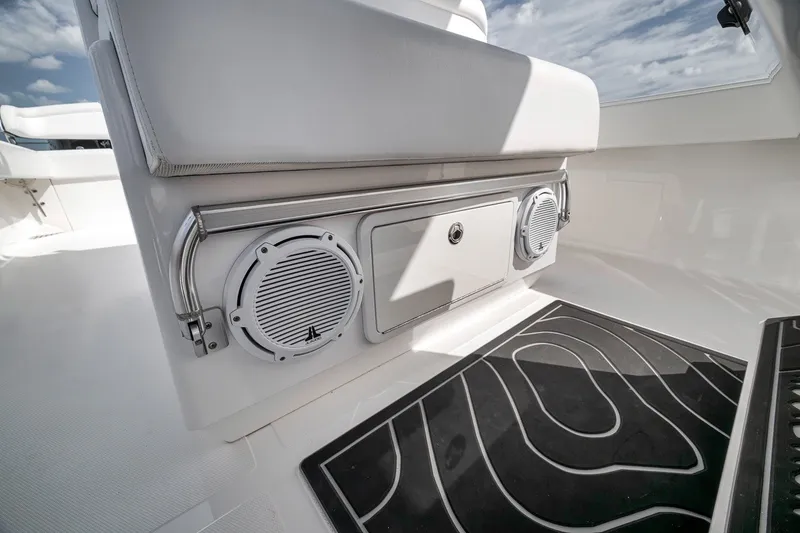 Slide: The Image of Interior of 2016 Bahama 41 boat featuring speakers and sleek seating design. - 12