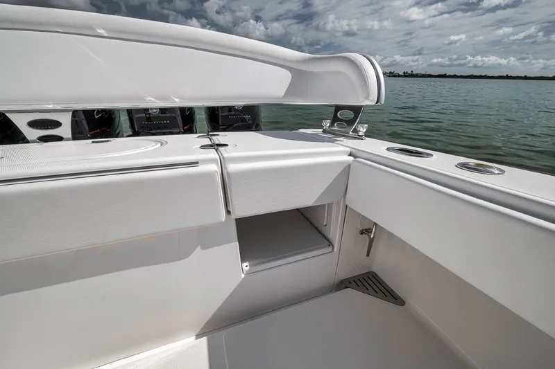 Slide: The Image of 2016 Bahama 41 boat interior with storage compartment, sleek design, and ocean view. - 21