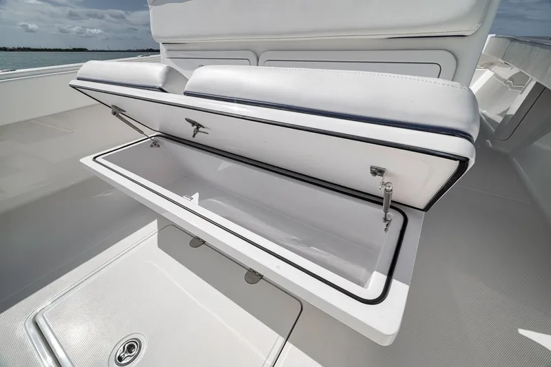 Slide: The Image of Open storage compartment on 2016 Bahama 41 boat, showcasing spacious interior. - 13