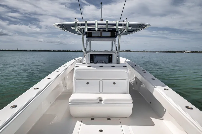 Slide: The Image of 2016 Bahama 41 boat interior with helm, open water view. - 24