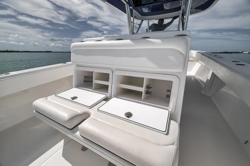 Slide: The Image of 2016 Bahama 41 boat interior with cushioned seating and storage compartments. - 14