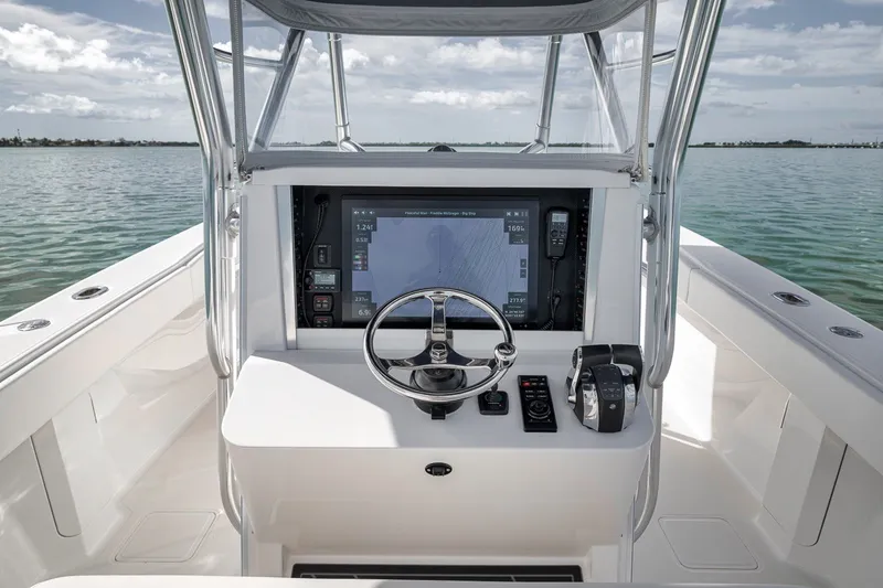 Slide: The Image of Center console of a 2016 Bahama 41 boat with navigation equipment. - 6