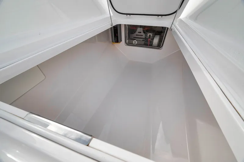 Slide: The Image of Spacious storage compartment in 2016 Bahama 41 boat, featuring sleek white interior design. - 33