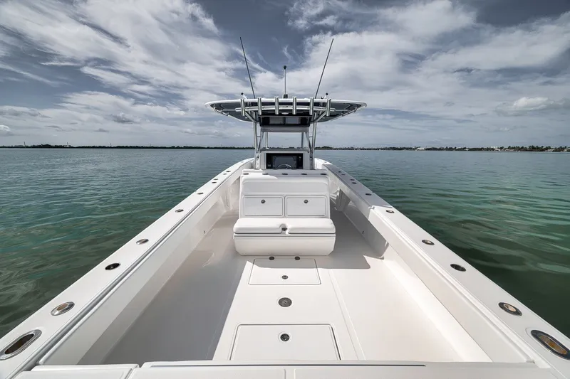Slide: The Image of 2016 Bahama 41 boat on calm water under cloudy sky. - 23