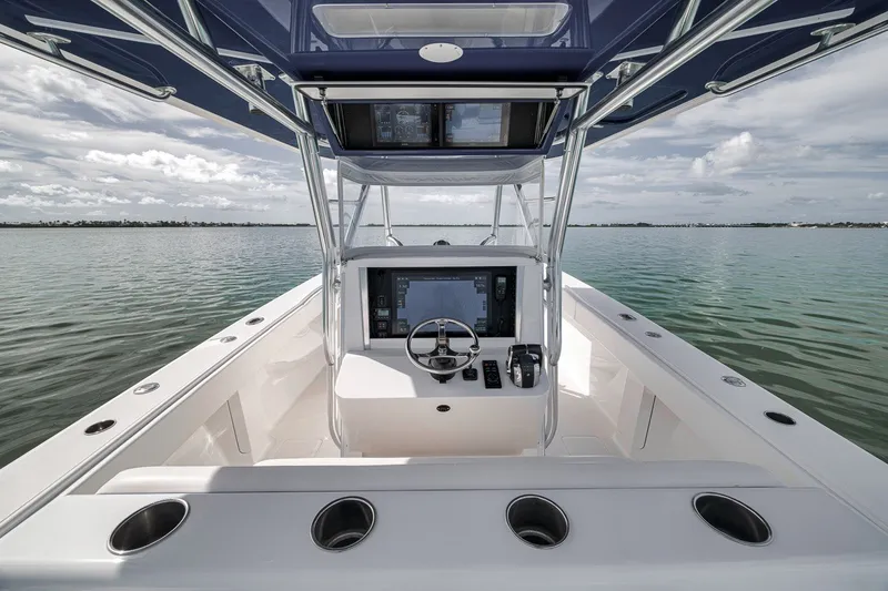 Slide: The Image of Center console of a 2016 Bahama 41 boat on calm water. - 8