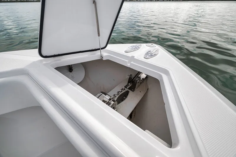 Slide: The Image of Open anchor compartment on 2016 Bahama 41 boat, showing chain and mechanism. - 34