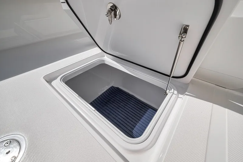 Slide: The Image of Open storage compartment on a 2016 Bahama 41 boat deck. - 16