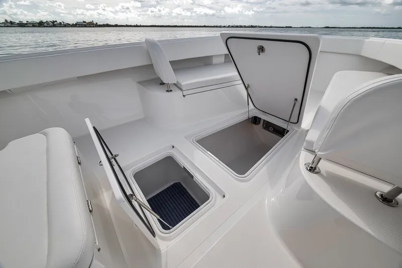 Slide: The Image of 2016 Bahama 41 boat interior with open storage compartments and seating. - 31