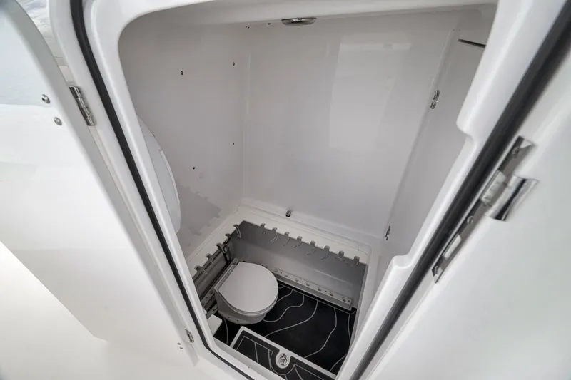 Slide: The Image of Interior view of a 2016 Bahama 41 boat's compact bathroom space. - 26