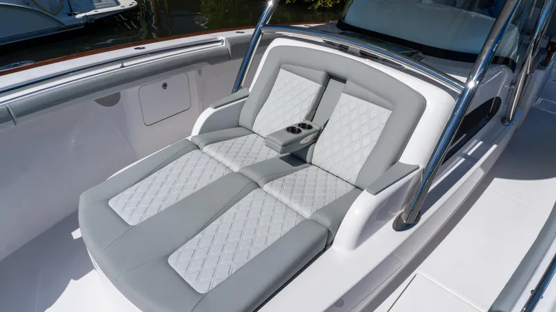 Slide: The Image of Luxurious seating on 2026 Mag Bay 43 CC boat with elegant gray upholstery. - 13