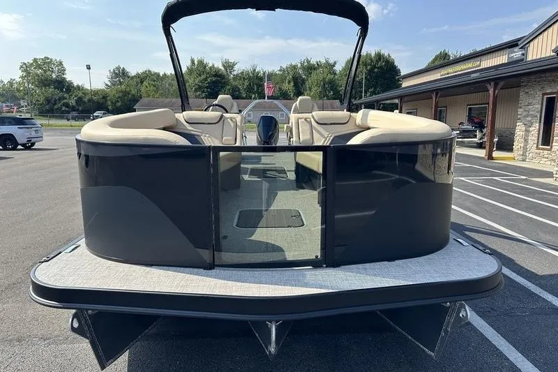 Slide: The Image of 2026 Flamingo Rove 24' pontoon boat in parking lot, rear view with seating. - 27