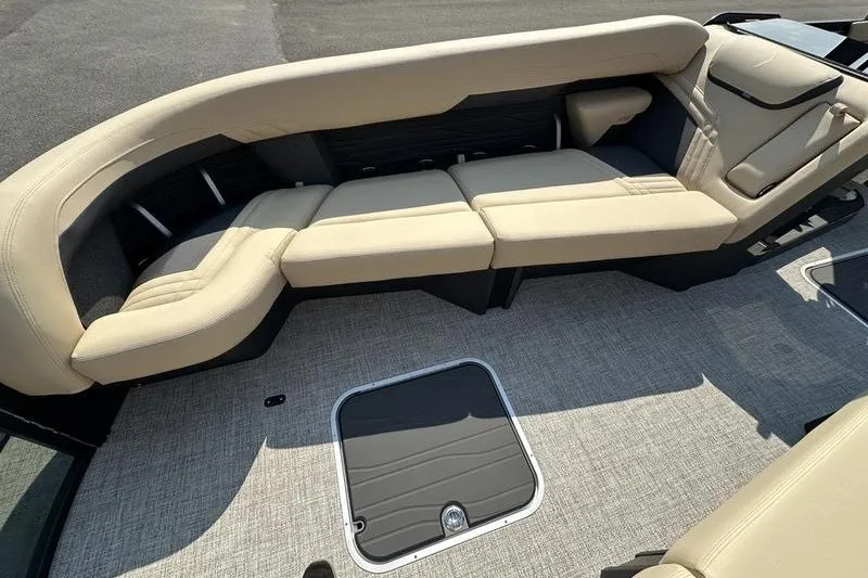 Slide: The Image of Luxurious seating on 2026 Flamingo Rove 24' boat, featuring beige upholstery and spacious layout. - 16