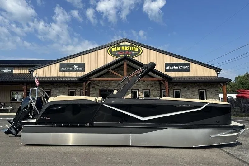 Slide: The Image of 2026 Flamingo Rove 24' boat displayed outside Boat Masters dealership. - 35