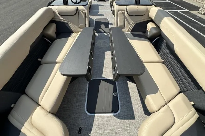 Slide: The Image of Luxurious interior of 2026 Flamingo Rove 24' boat with beige seating and sleek tables. - 45