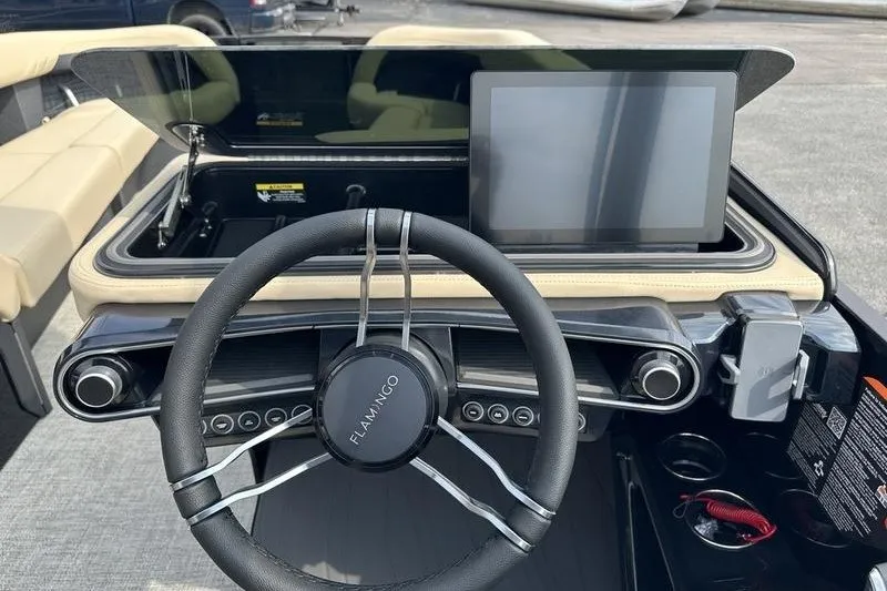 Slide: The Image of Steering wheel and dashboard of 2026 Flamingo Rove 24' boat with touchscreen display. - 43