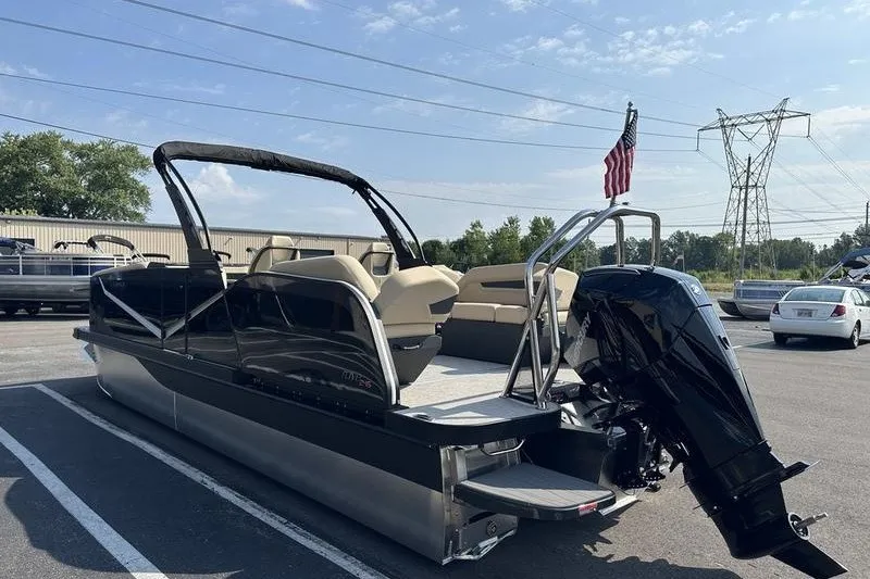 Slide: The Image of 2026 Flamingo Rove 24' pontoon boat with outboard motor in parking lot. - 38