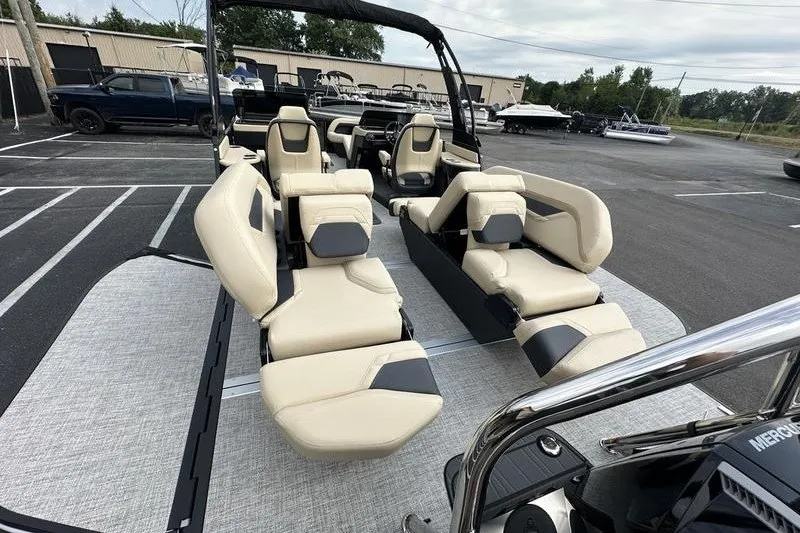 Slide: The Image of 2026 Flamingo Rove 24' boat with luxurious seating in a parking lot. - 46