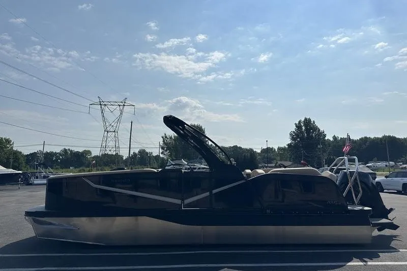 The Image of 2026 Flamingo Rove 24' pontoon boat parked under a clear blue sky. - 0