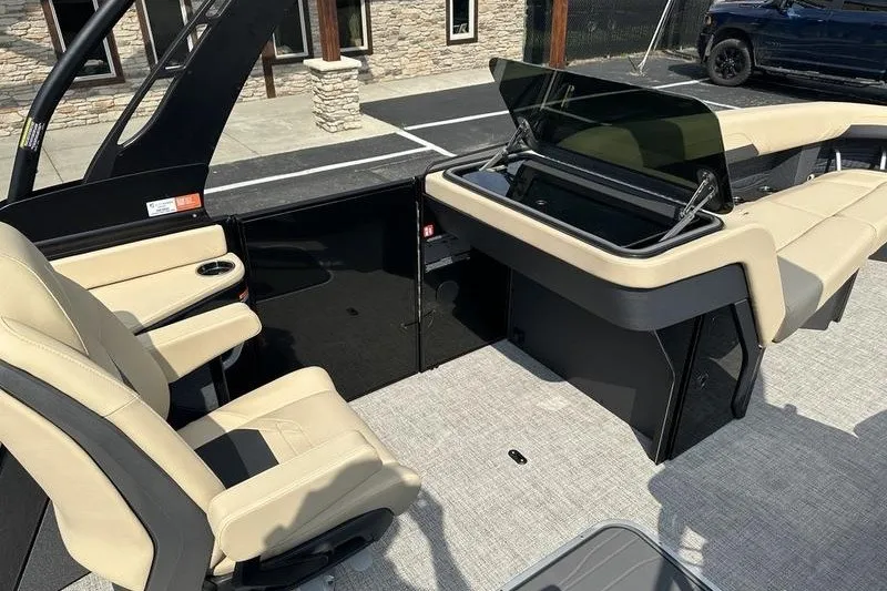 Slide: The Image of Interior of 2026 Flamingo Rove 24' boat with beige seating and sleek design. - 51