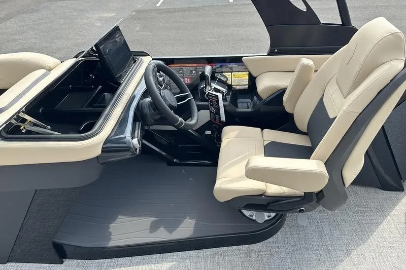 Slide: The Image of Interior of 2026 Flamingo Rove 24' boat with beige seats and modern dashboard. - 32