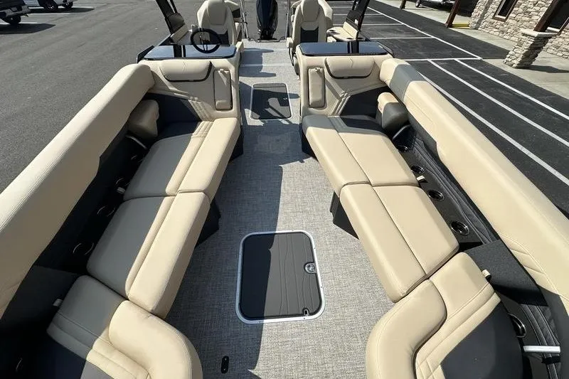 Slide: The Image of Luxurious interior of 2026 Flamingo Rove 24' boat with beige seating and modern design. - 21