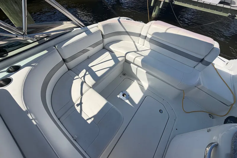 Slide: The Image of 2004 Formula 260 Bowrider interior with white seating and cup holders. - 24