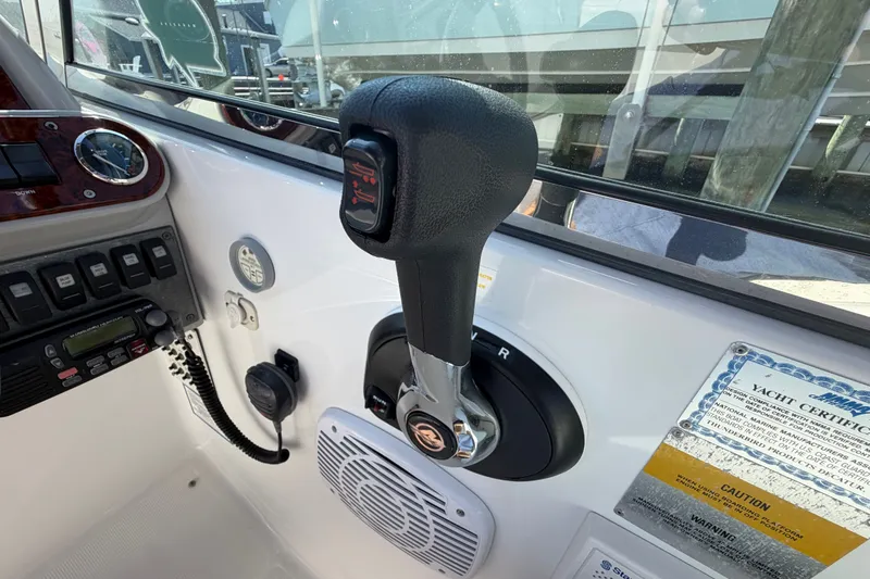 Slide: The Image of Throttle control of a 2004 Formula 260 Bowrider boat cockpit. - 21