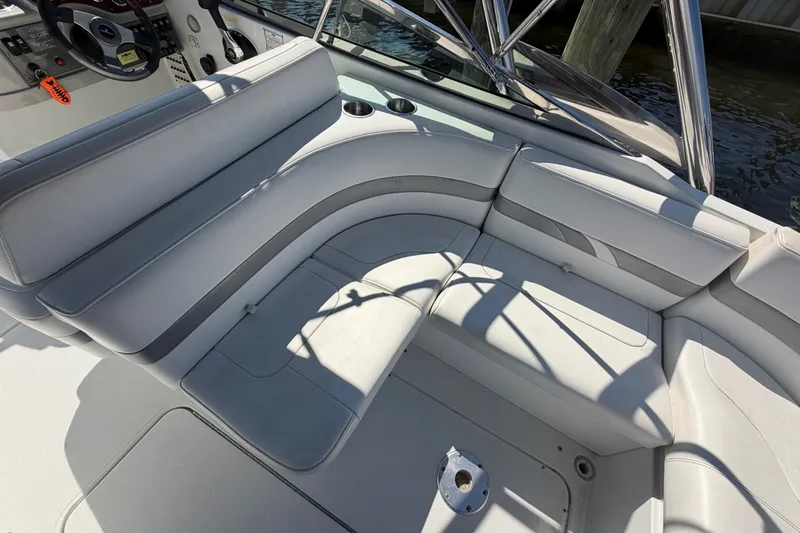 Slide: The Image of 2004 Formula 260 Bowrider interior with white seating and steering wheel. - 26