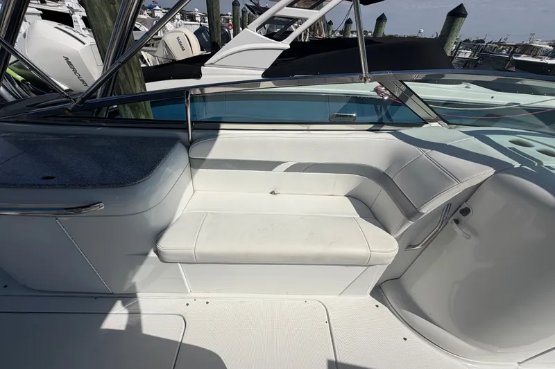 Slide: The Image of 2004 Formula 260 Bowrider interior with white seating and sleek design. - 22