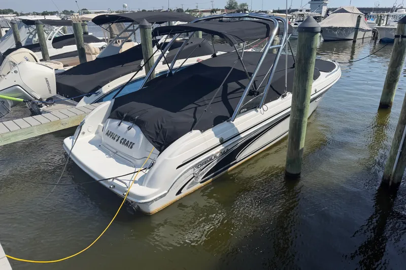 Slide: The Image of 2004 Formula 260 Bowrider docked at marina, covered with black canopy. - 37
