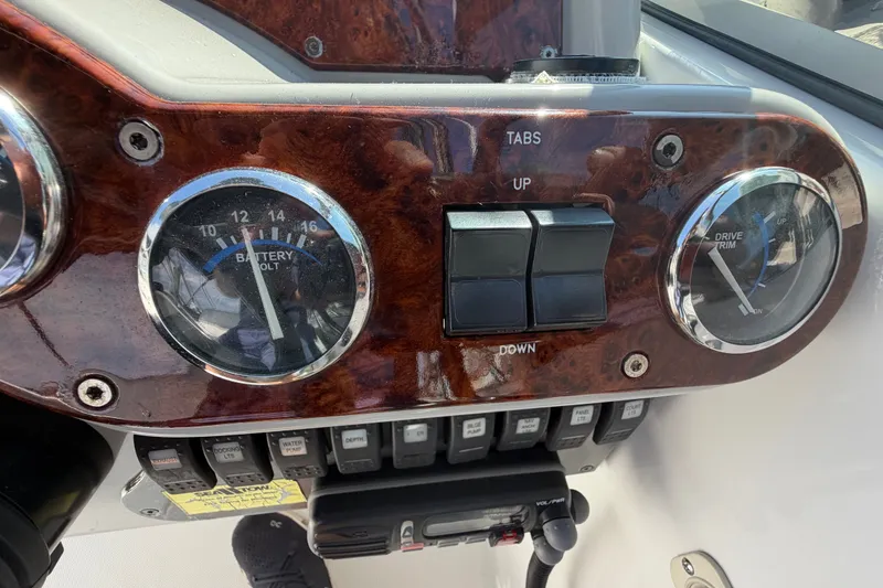 Slide: The Image of Dashboard of a 2004 Formula 260 Bowrider boat with gauges and controls. - 19