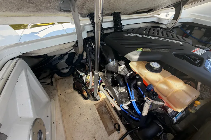 Slide: The Image of Engine compartment of a 2004 Formula 260 Bowrider with Mercury engine components. - 36
