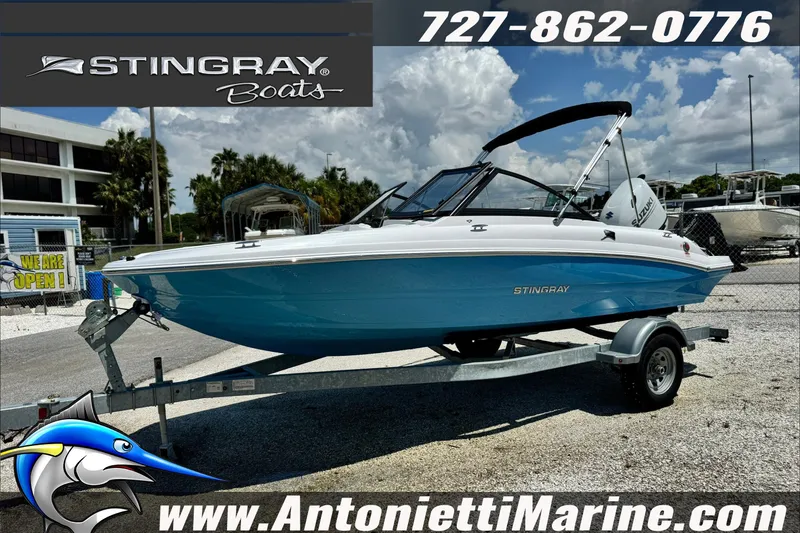 The Image of 2027 Stingray 19 DC boat on trailer at Antonietti Marine dealership. - 0