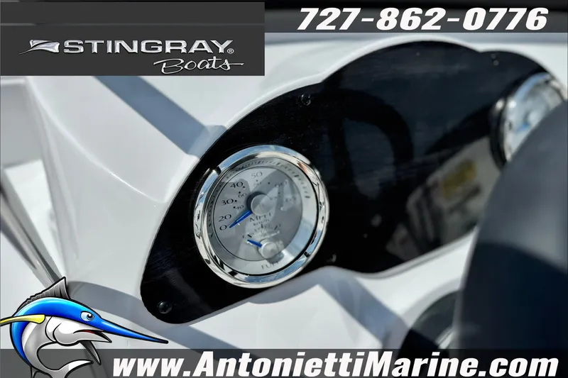 Slide: The Image of Dashboard of 2027 Stingray 19 DC boat with speedometer, contact details, and logo. - 22
