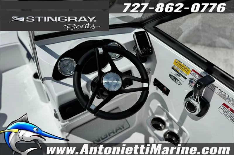 Slide: The Image of Steering console of 2027 Stingray 19 DC boat with controls and gauges. - 21