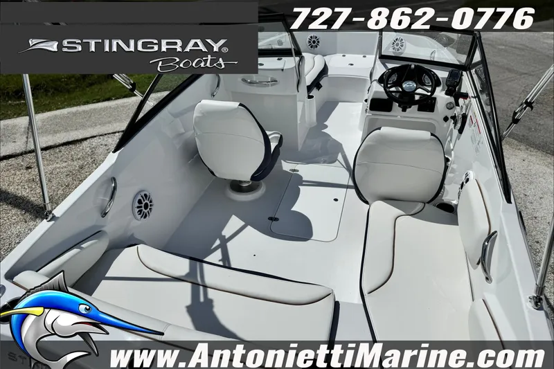 Slide: The Image of 2027 Stingray 19 DC boat interior with seating and steering wheel, featuring Antonietti Marine branding. - 12