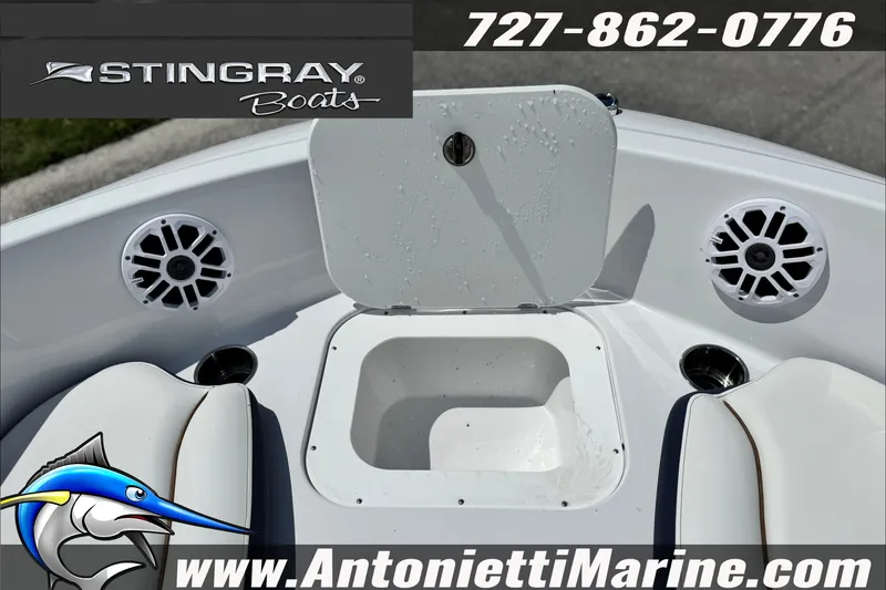 Slide: The Image of 2027 Stingray 19 DC boat interior with speakers and storage compartment. - 14
