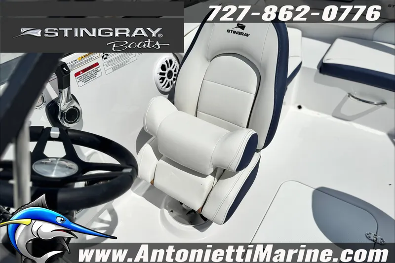 Slide: The Image of Stingray 19 DC 2027 boat interior with steering wheel and seating, Antonietti Marine branding. - 29