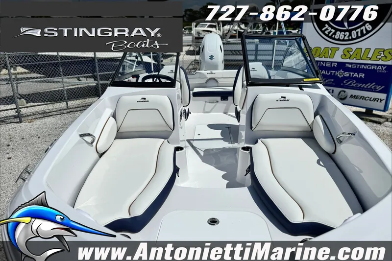 Slide: The Image of 2027 Stingray 19 DC boat interior with white seating, displayed at Antonietti Marine. - 11