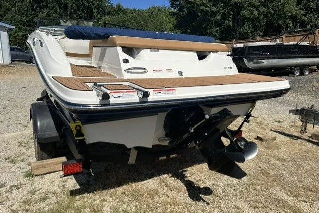 Slide: The Image of 2018 Sea Ray SPX 190 boat on trailer, rear view, parked outdoors. - 18