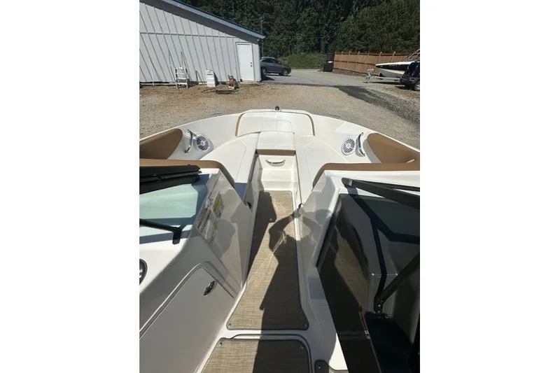 Slide: The Image of 2018 Sea Ray SPX 190 boat interior with beige seating and open deck. - 25