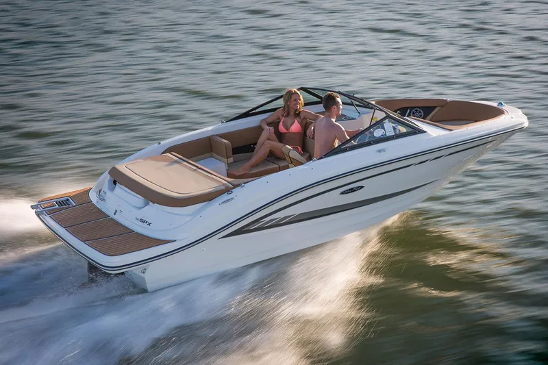 Slide: The Image of Manufacturer Provided Image: 2018 Sea Ray SPX 190 boat cruising on water with two passengers. - 0